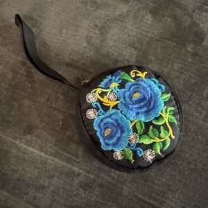 NWOT- Black round Wristlet Coin Purse with Blue Floral Embroidery.